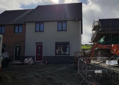 Coloured Spray Render Residential Estate Fishguard - APW Homes