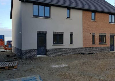 Coloured Spray Render Residential Estate Fishguard - APW Homes