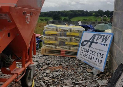 Spray render machine and render at the ready - Liquid Screed Jobs Autumn 2018 - APW Homes