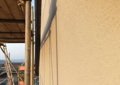 Yellow Spray Rendering Fishguard - APW Homes